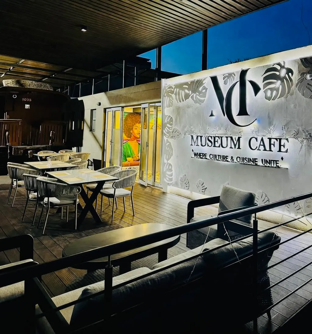 Museum Cafe signage on the glazed frontage above the timber deck